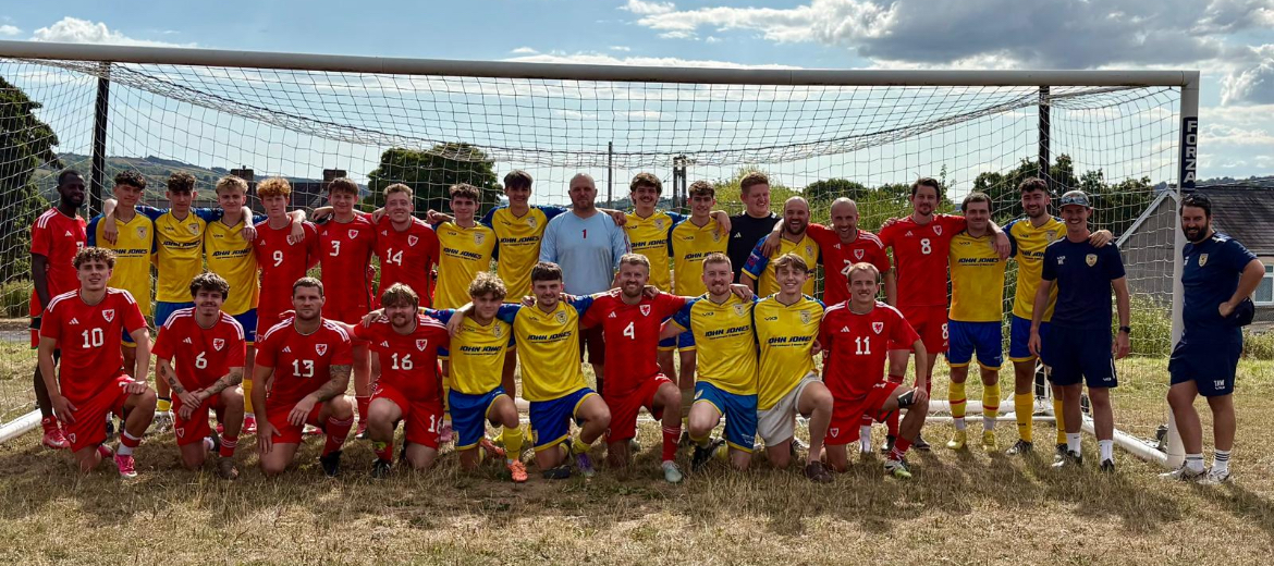 Drefach senior players with a Wales side in front of the goal